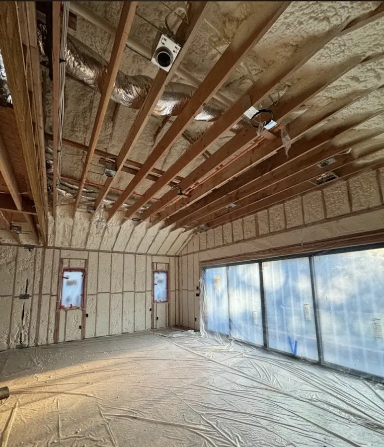 Interior walls and ceiling insulated with spray foam during new construction in Miramar Beach